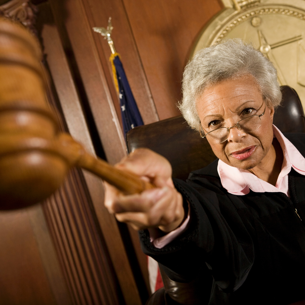 Judge punishing holding person in contempt of court in a Massachusetts divorce.