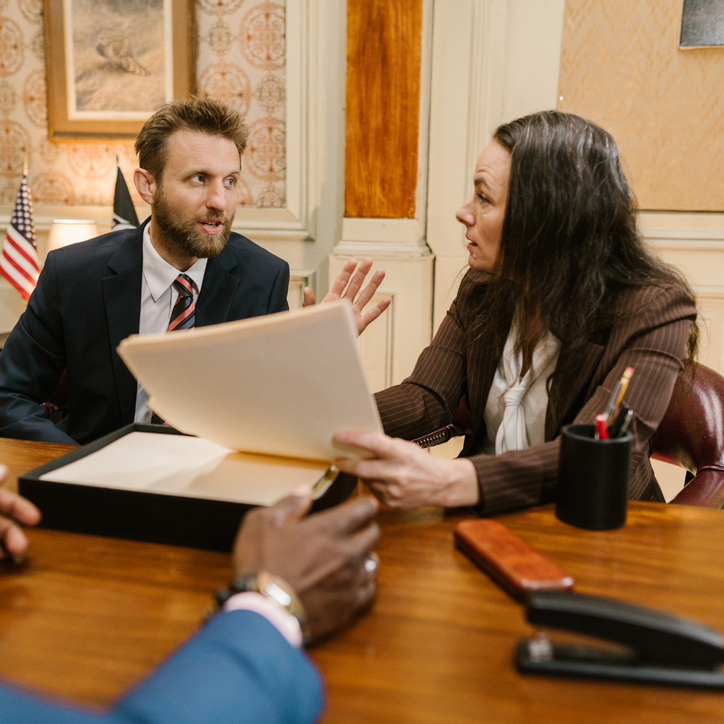 Lawyers negotiating at a Massachusetts pre-trial conference