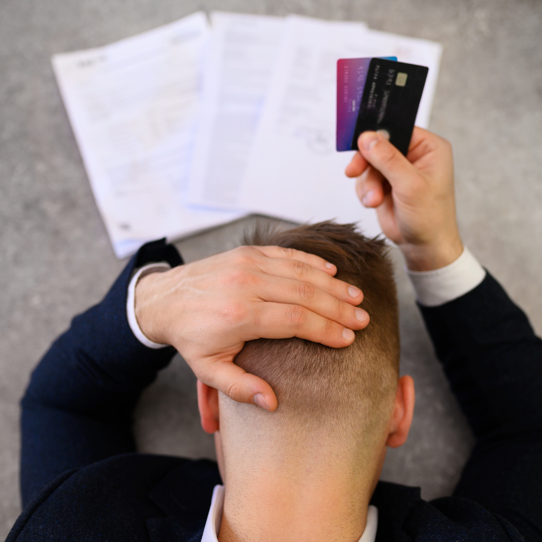 Man paying credit cards in a Massachusetts divorce.