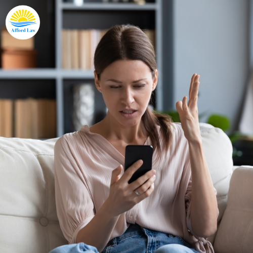 Angry woman on phone being harassed in Massachusetts.