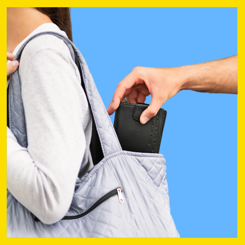 Man stealing wallet from woman's purse in Massachusetts.