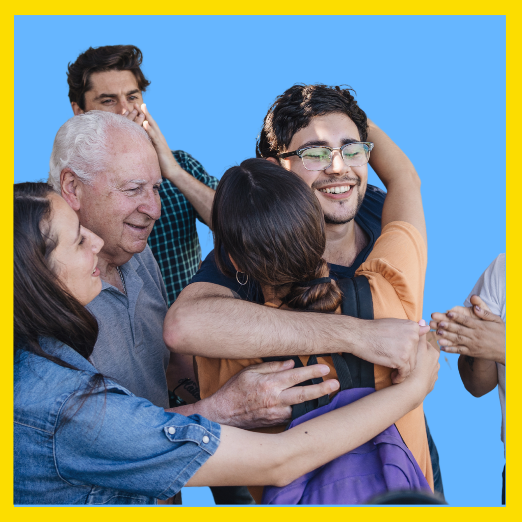 Massachusetts man hugging his family after being released from jail on personal recognizance.