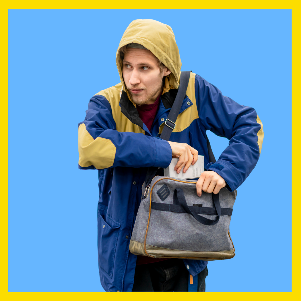 Man concealing merchandise in his bag.