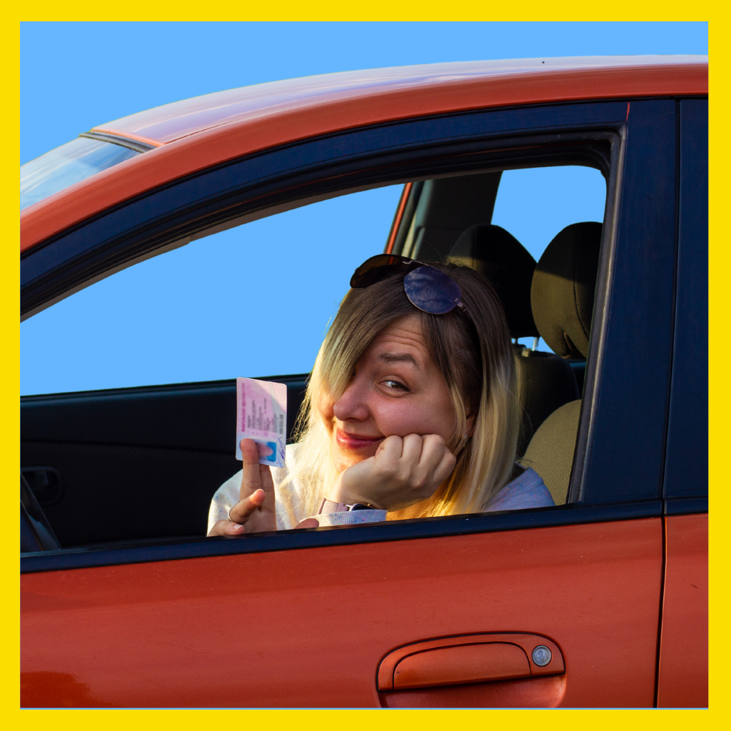 Woman driver holding a Massachusetts driver's license that has been suspended.