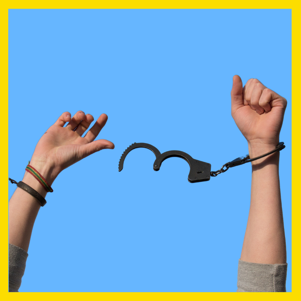 Man taking off handcuffs.