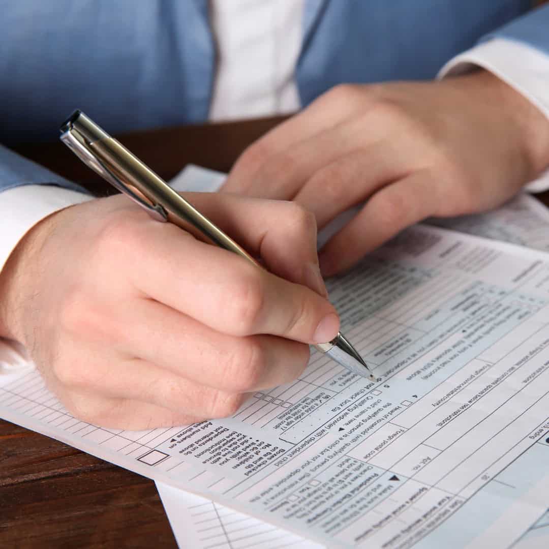 Husband filing divorce paperwork in Massachusetts