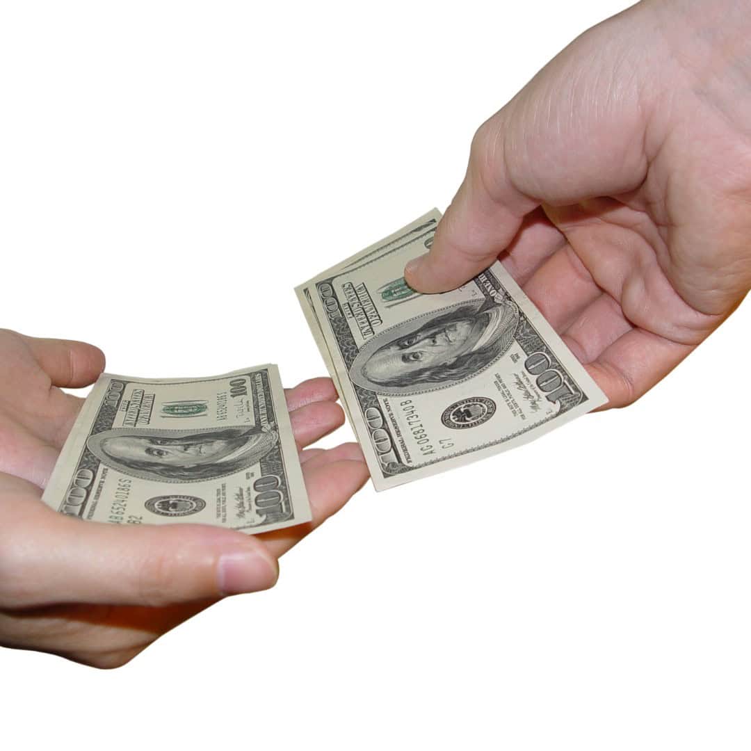 Massachusetts legal services - A person handing over a $100 bill to another person, symbolizing financial transactions or legal set.