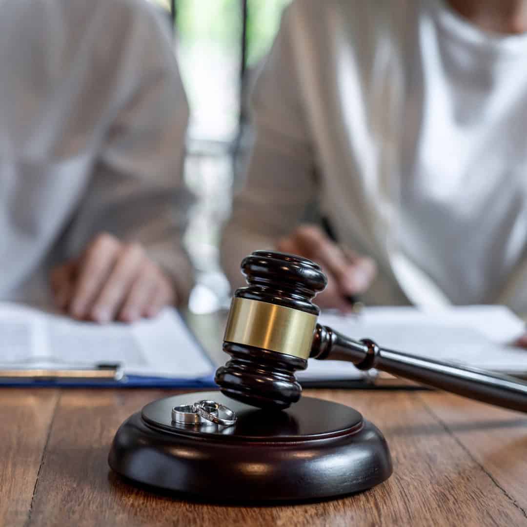 Massachusetts legal services - A gavel and legal documents on a wooden table in a law office setting.