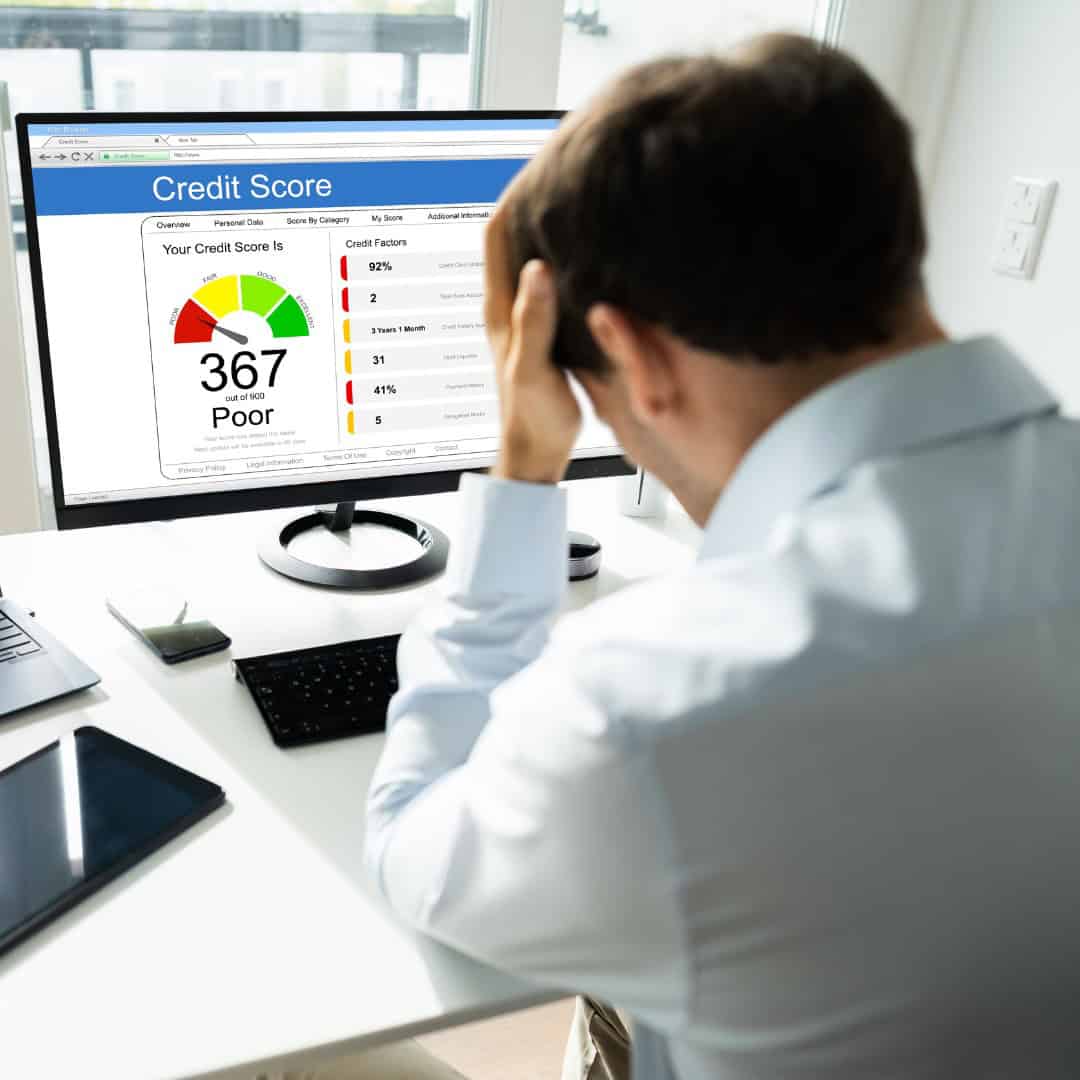 Resources 8 Massachusetts legal services - Poor credit score displayed on computer screen with credit factors and score details.