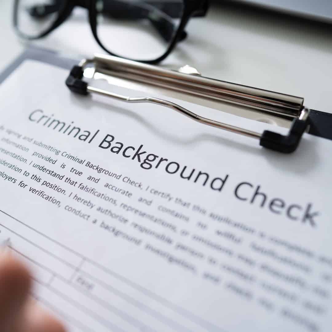 Resources 1 Criminal background check form on clipboard.