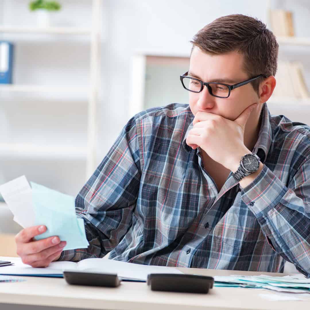 Resources 11 Man with bills to pay after divorce.