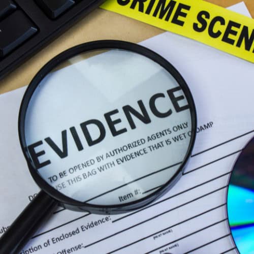 Magnifying glass looking at evidence of Massachusetts harassment.