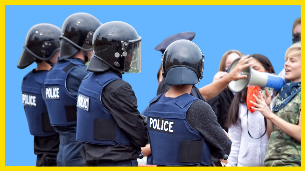 Protesters facing off against police.