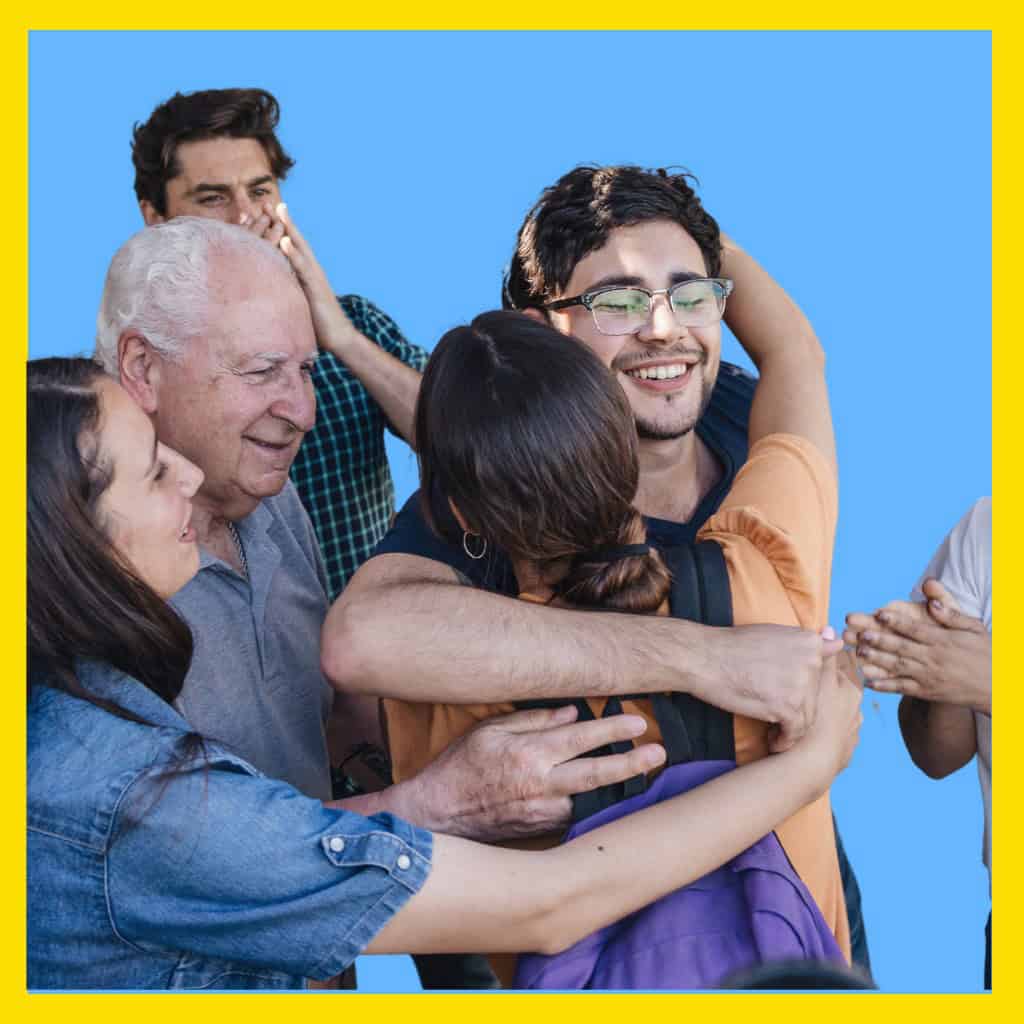 Massachusetts man hugging his family after being released from jail on personal recognizance.