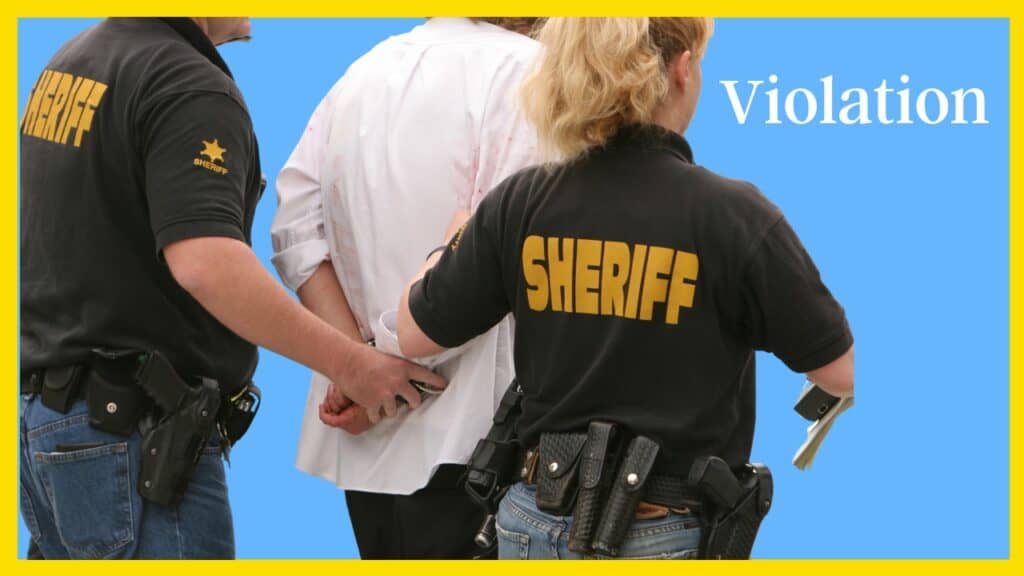 Massachusetts probation violator being taken away in handcuffs.